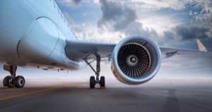 Airplane wing and engine while plane is on tarmac